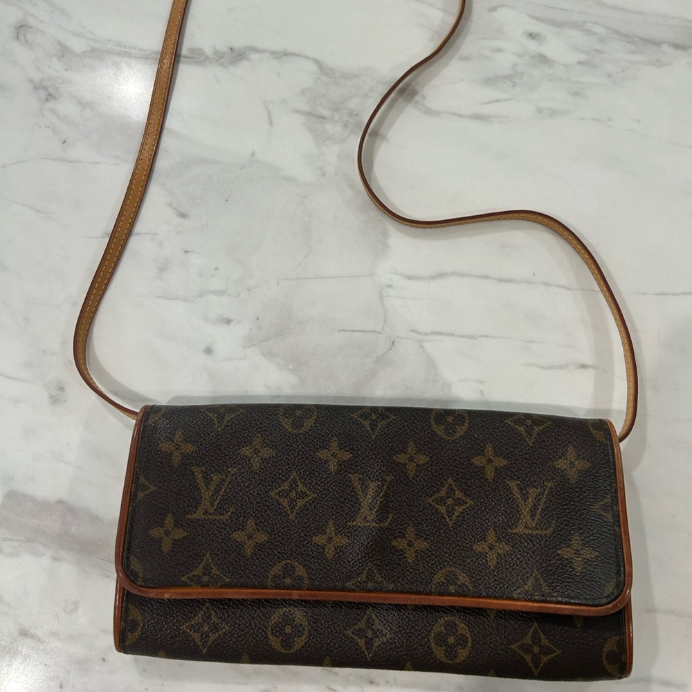 Louis Vuitton clutch purse with strap